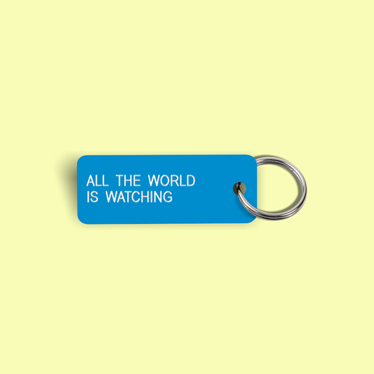 ALL THE WORLD IS WATCHING Keytag (2022-03-03)
