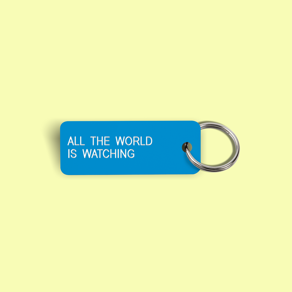ALL THE WORLD IS WATCHING Keytag (2022-03-03)